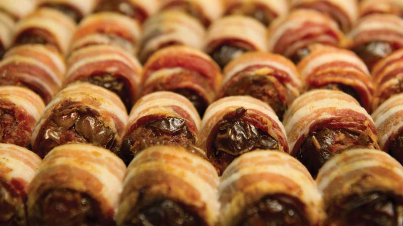 bacon-wrapped, chorizo-filled dates, photo by Barbara Johnston