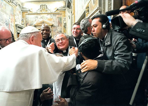 The author, center, meets the Holy Father in the Sala Regia, photo courtesy L'Osservatore Romano