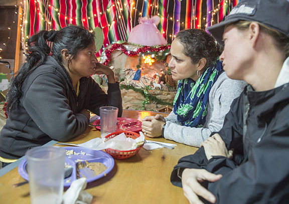 The author, center, interviews a deported migrant at the Kino shelter in Nogales, Mexico; Photos by Barbara Johnston.