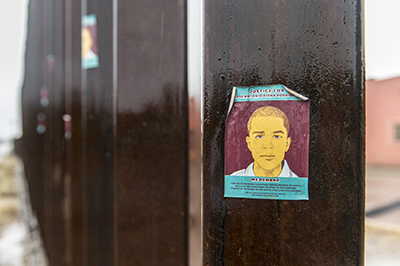 Stickers on the border wall protest the shooting death of 16-year-old Jose Antonio Elena Rodriguez on the Mexican side of Nogales, allegedly by a U.S. Border Patrol agent.