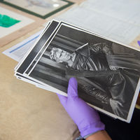Photographs from historic Shakespeare performances were among the artifacts Robinson Shakespeare Company members handled with gloved care.