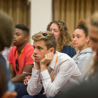 Forest Wallace and fellow Robinson Shakespeare ensemble members listen during a discussion with Nick Walton of the Shakespeare Birthplace Trust.