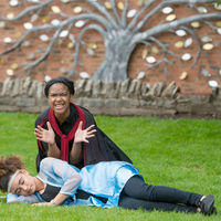 Iachimo (Kennedi Bridges) kneels beside a sleeping Imogen (Precious Parker) during a rehearsal of Cymbeline at Shakespeare's New Place in Stratford-upon-Avon, England.