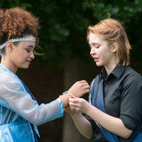 Posthumus (Ophelia Emmons), right, clasps a manacle of love on his wife, Imogen (Precious Parker).