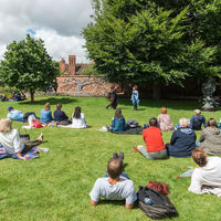 Visitors to Shakespeare's New Place gather in the Great Garden to watch the Robinson Shakespeare Company's performance of Cymbeline.