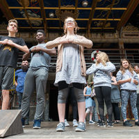 Actors from the Robinson Shakespeare Company participate in a stage movement workshop at the Globe Theatre in London.