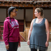 Kennedi Bridges, left, and Christy Burgess make eye contact during an exercise in a workshop with the Master of Movement at Shakespeare's Globe, Glynn MacDonald.