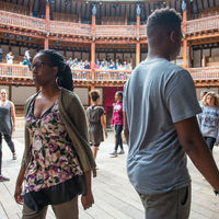Robinson Shakespeare Company actors stride around the stage at the Globe Theatre in London.