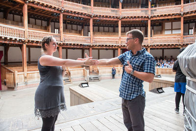 Christy Burgess and Scott Jackson participate in the Robinson Shakespeare Company's movement workshop at Shakespeare's Globe.