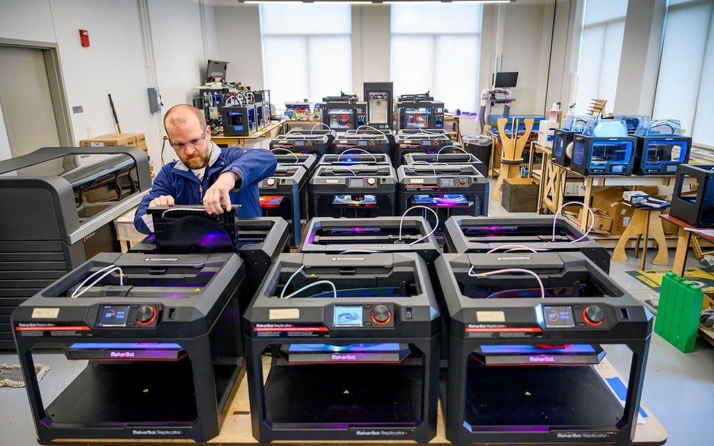 Professor Matt Leevy checks a 3D Printer