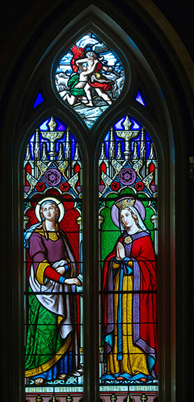 St. Cecilia, left, playing the organ