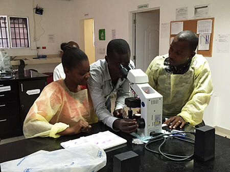 Technicians in training at IHI's new pathology lab in Cap Haitien, photo courtesy of the author.