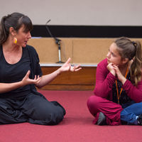 Robinson Shakespeare Company member Lizzie Graff listens as director Gemma Fairlie leads a workshop for the ensemble about directing Shakespeare plays.