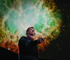 Peter Garnavich in Jordan Hall's Digital Visualization Theater, photo by Matt Cashore