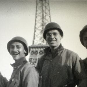Bernard Cullen stands with friends near the Eiffel Tower in Paris after France's liberation during World War II.