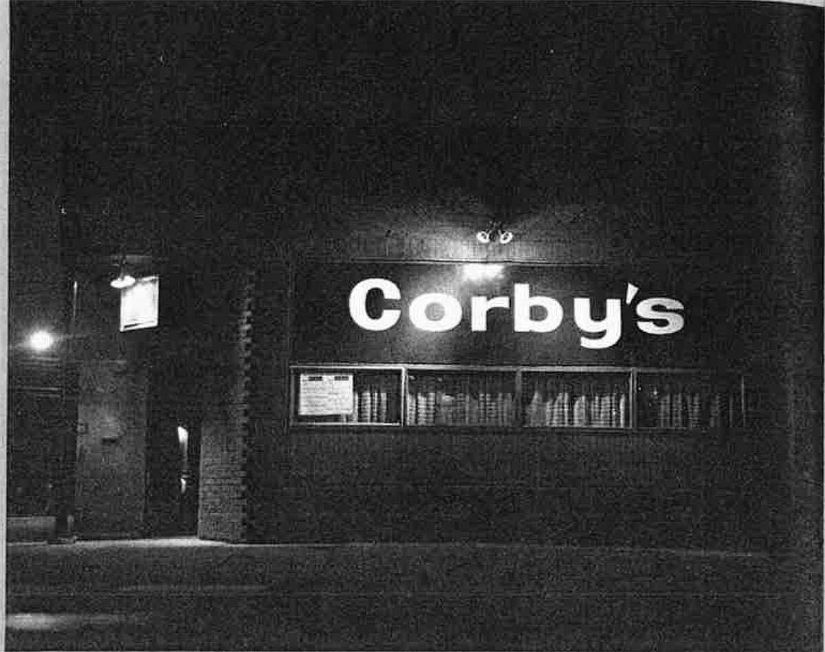 Black and white photo of the facade of Corby's bar