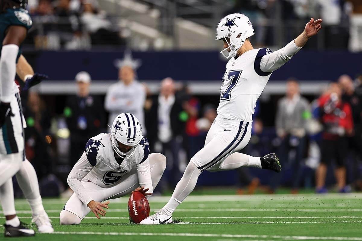 Dallas Cowboys kicker Brandon Aubrey prepares to swing his leg through the ball on a field-goal attempt.