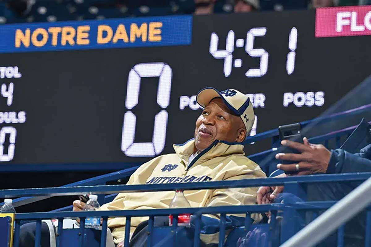 Former Notre Dame men's basketball player Dwight Clay sits in the stands during a game as the 50th anniversary of his game-winning shot against UCLA approached.
