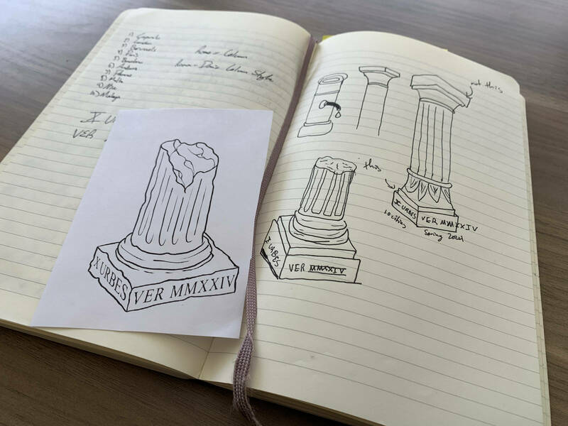 Drawings in a notebook and a final sketch of a slightly crumbling column as a model for a tattoo.