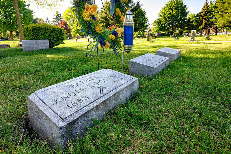 A photo of a Knute Rockne's gravestone after his casket was transferred to Notre Dame's Cedar Grove cemetery