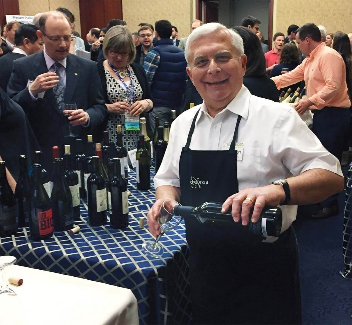 Mike Gianunzio pouring wine as the steward at a Washington, D.C., reception for Pacific Northwest congressional staff