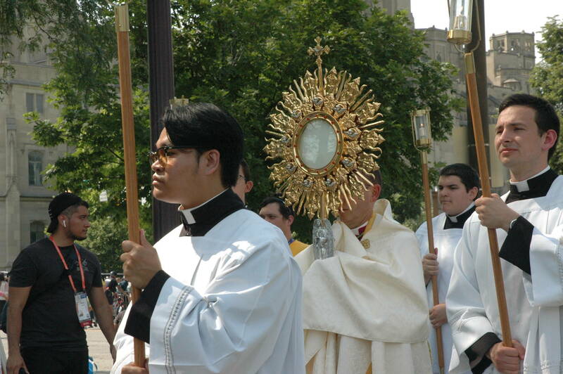 A monstrance containing the Eucharist is carried toward the Indiana War Memorial in Indianapolis, part of a mile-long procession that drew more than 50,000 Catholics to the city’s streets on July 20 during the National Eucharistic Congress.