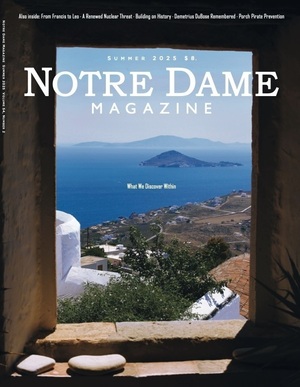 Notre Dame Magazine, Summer 2025 cover. A view through a window of whitewashed buildings, green foliage, and a blue bay with a small island, under the title "What We Discover Within."